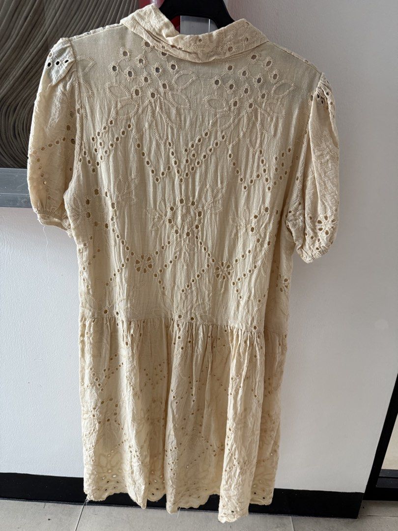 Cream Eyelet Embroidered Button Down Midi Dress (Category: Dresses) located in Mandaluyong City. Submitted by declutteringmylife101 (Listing ID 1467626410, Image 2). Description: - Color: Cream with allover eyelet embroidery and floral patterns - Design: Collared neckline, front button closure, and short puff sleeves - Fit: Dropped waist with a flattering gathered skirt - Feature: Includes two convenient side pockets - Material: Lightweight and c