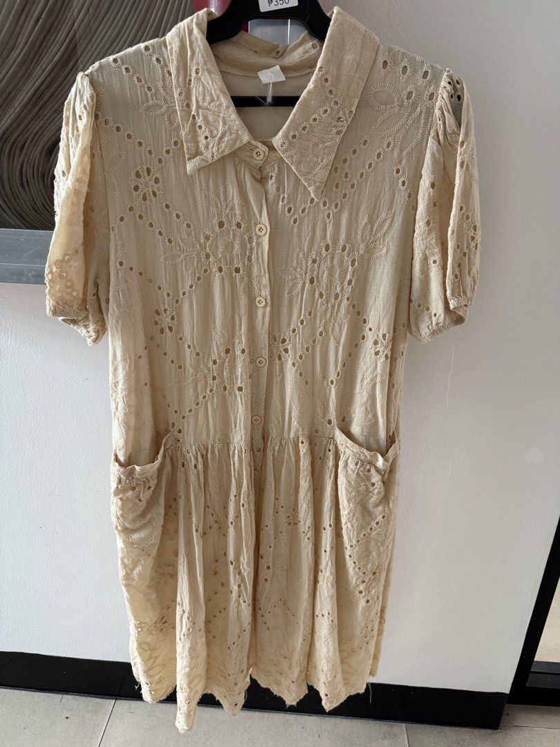 Cream Eyelet Embroidered Button Down Midi Dress (Category: Dresses) located in Mandaluyong City. Submitted by declutteringmylife101 (Listing ID 1467626410, Image 1). Description: - Color: Cream with allover eyelet embroidery and floral patterns - Design: Collared neckline, front button closure, and short puff sleeves - Fit: Dropped waist with a flattering gathered skirt - Feature: Includes two convenient side pockets - Material: Lightweight and c