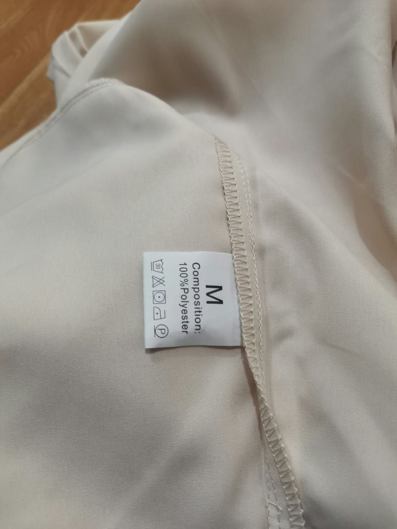 Cream wide leg trousers (Category: Jeans) located in Manila. Submitted by mahanaim.67c328 (Listing ID 1467759981, Image 3). Description: - Size: M - Color: Cream - Material: 100% polyester - Design: Pleated front with zipper fly and button closure - Style: Versatile for casual or formal wear .