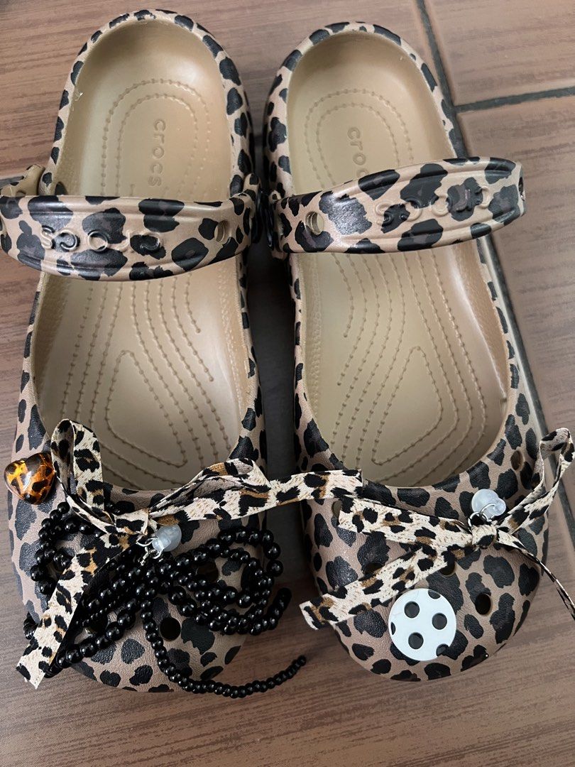 CROCS authentic leopard ballet clog (Category: Flats & Sandals) located in Makati City. Submitted by raket_era (Listing ID 1467636507, Image 3). Description: Authentic Crocs — Classic Animal Ballet Clog • w/ free jibbitz • Color: Leopard / Animal Print on warm tan base • Size: US Women’s 6 / EUR 36–37 / UK 4 / CN 230mm • Material: Soft lightweight Croslite™ foam — water-friendly, easy to clean • Mary Jane / ballet flat silhouette with adjustable 