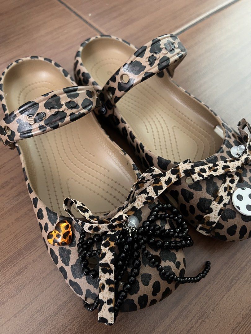 CROCS authentic leopard ballet clog (Category: Flats & Sandals) located in Makati City. Submitted by raket_era (Listing ID 1467636507, Image 2). Description: Authentic Crocs — Classic Animal Ballet Clog • w/ free jibbitz • Color: Leopard / Animal Print on warm tan base • Size: US Women’s 6 / EUR 36–37 / UK 4 / CN 230mm • Material: Soft lightweight Croslite™ foam — water-friendly, easy to clean • Mary Jane / ballet flat silhouette with adjustable 