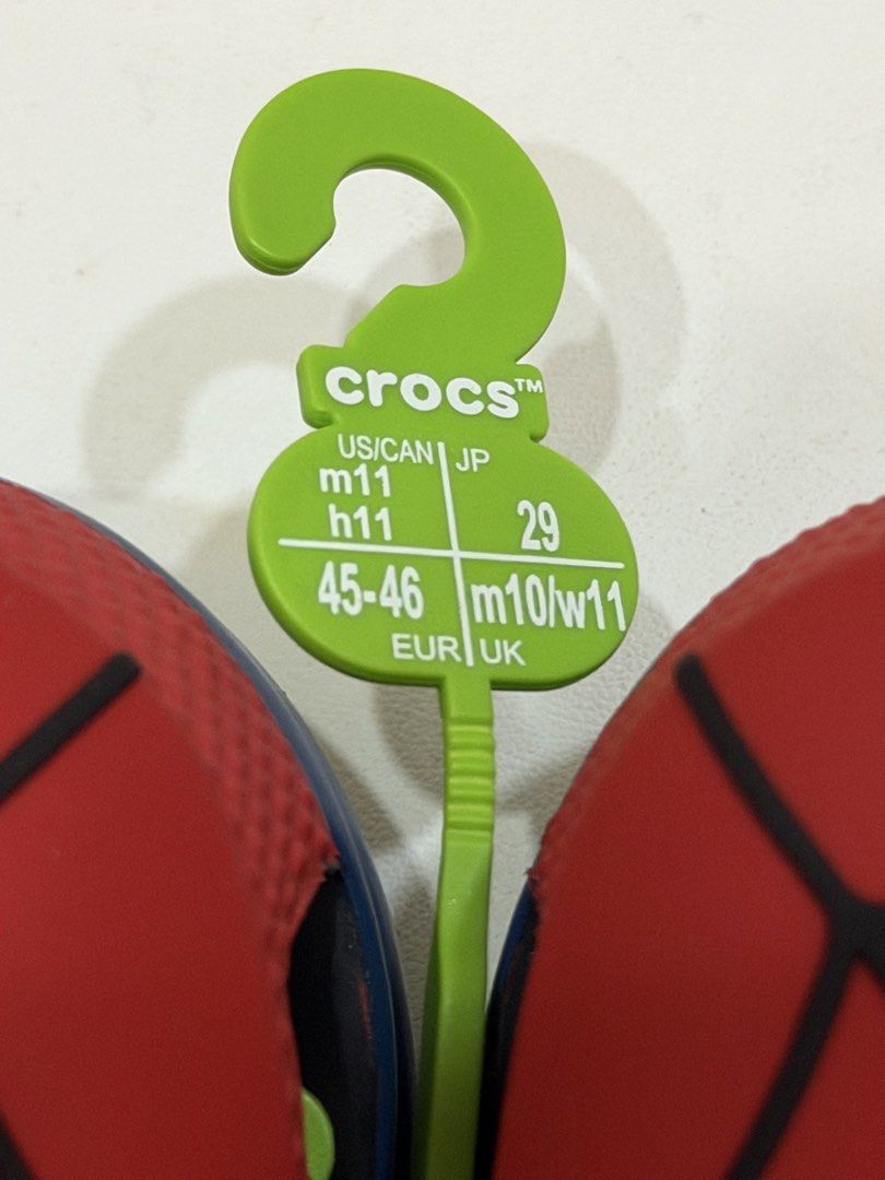 Crocs Marvel Studios Spider-Man Clogs (Category: Slippers & Slides) located in Las Pinas. Submitted by thereng (Listing ID 1467749846, Image 2). Description: Brand new with store hanger attached. Size US M11 / W11, EUR 45-46. Ordered from US. Marvel Studios Spider-Man Crocs clogs. Red upper with black web pattern and white eye details. Classic slip-on design with pivoting heel strap. .