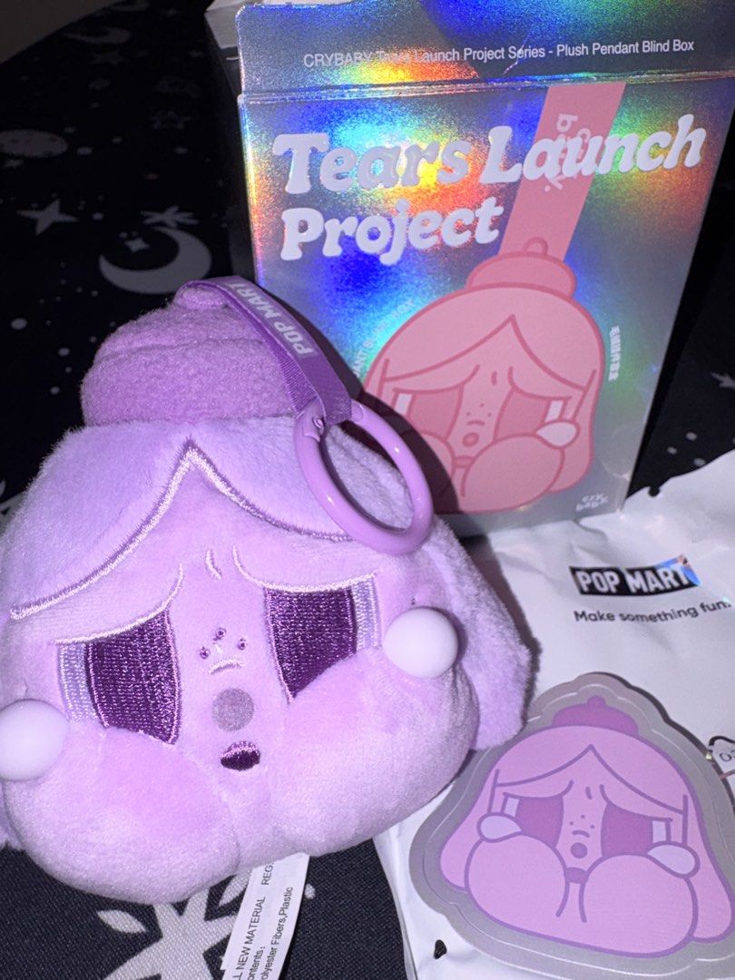 Crybaby Tears Launch project (Category: Designer & Blind Box Toys) located in Taguig. Submitted by _nicsss (Listing ID 1467770654, Image 1). Description: - Authentic Pop Mart Crybaby Tears Launch Project plush pendant in purple - Box opened strictly to check character (blind box item) - Includes original foil packet, collector card, and holographic box, sticker, paper bag - Clean, pristine condition and stored safely after opening 💸 SRP: ₱700 🏷