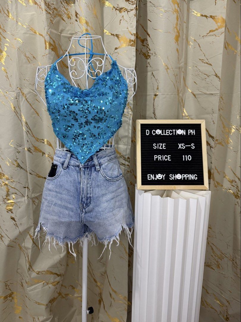 D Collection PH Outfits Assorted Styles and Sizes (Category: Sets or Coordinates) located in Cebu City. Submitted by jovjovcim60300 (Listing ID 1467716887, Image 1). Description: - Trendy crop top and high-waisted frayed denim shorts sets - Available Styles: Blue sequin halter, sage green ruched tube, black ruffle strapless, tropical floral wrap, and black spider graphic halter - Sizes: XS to L - Price: ₱99 to ₱110 only - Perfect for casual outin
