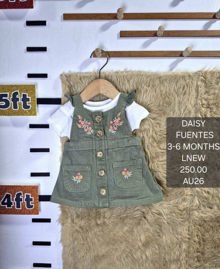 Daisy Fuentes Green Overalls Set with White Tee (Category: Babies & Kids Fashion) located in Jaen. Submitted by kmg0219 (Listing ID 1467610384, Image 1). Description: - Brand: Daisy Fuentes - Size: 3-6 months - Set includes: Olive green overall jumper dress (white short-sleeve undershirt not included) - Dress details: Floral embroidery, front buttons, and two front pockets - Material: Gentle and comfortable for baby girls.