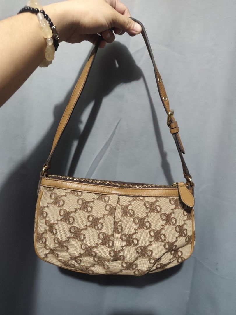 DAKS monogram canvas shoulder bag brown (Category: Luxury Bags & Wallets) located in Rizal. Submitted by chicout (Listing ID 1467617952, Image 2). Description: - Authentic DAKS shoulder bag - Beige monogram canvas with brown leather trim - Adjustable strap for a custom fit - Secure top zip closure with gold-tone hardware - Clean fabric-lined interior with a zippered pocket and DAKS leather logo patch - Compact and structured design, ideal for dai