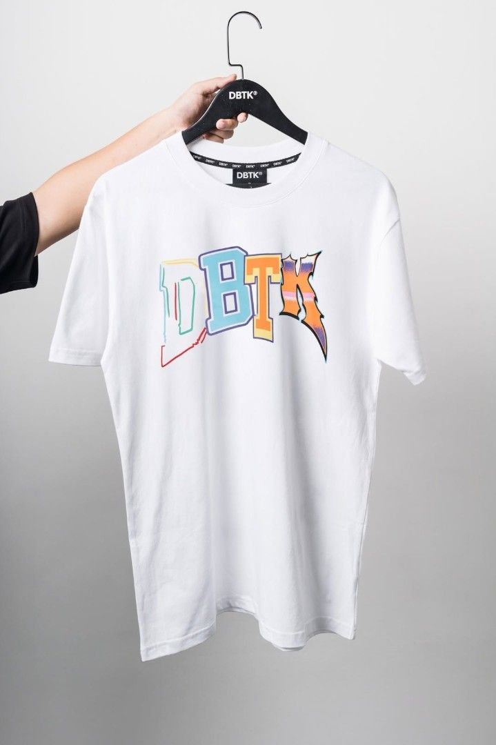 DBTK Box Fit Tee M 23x28 (Category: Tshirts & Polo Shirts ) located in Santa Rosa. Submitted by wel3993 (Listing ID 1467665402, Image 2). Description: DBTK Brandnew M os 23x27.5 💸1200 MOD. LBC MOP. BDO, GCASH LOC. NUEVA ECIJA Meet up. Santa rosa Nueva Ecija - Color: White - Fit: Box fit / Oversized Medium - Design: Multicolored graphic print on front and back - Condition: Brand new, still sealed in original plastic packaging with barcode tag - A