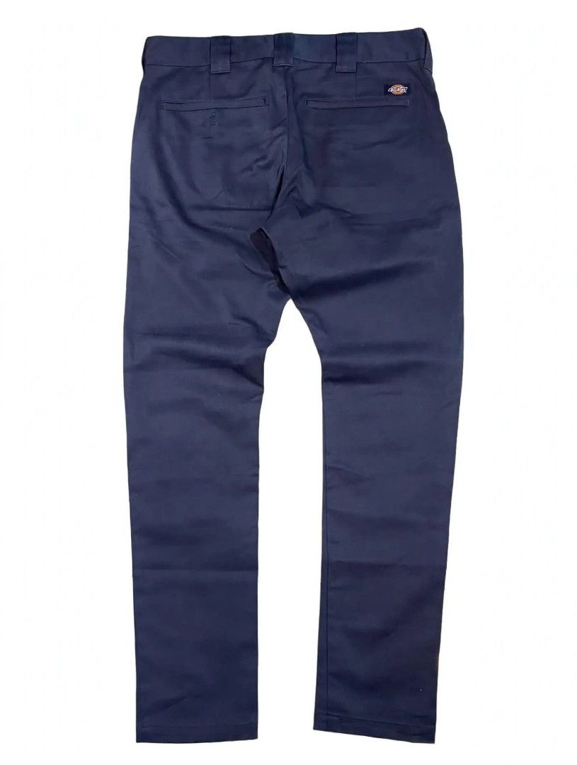 Dickies Navy Blue Chino Pants (Category: Chinos) located in Cainta. Submitted by mariss.luxx (Listing ID 1467651116, Image 2). Description: - Brand: Dickies - Color: Classic navy blue - Fit: Straight leg, versatile for casual wear or daily use - Material: Sturdy twill fabric with structured belt loops - Details: Branded inner waistband lining and signature Dickies logo patch on the back right pocket - Pockets: Functional rear welt pockets -W:36 L