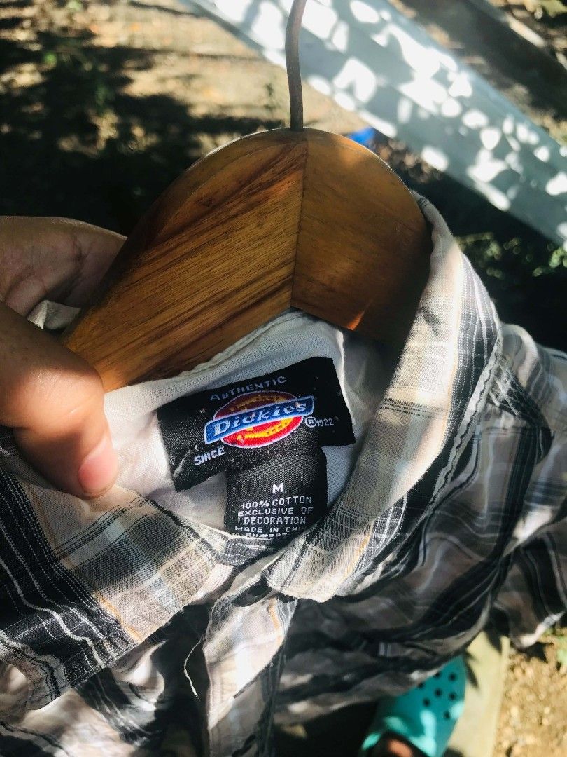 Dickies plaid short sleeve button up shirt medium (Category: Tshirts & Polo Shirts ) located in Camiling. Submitted by lester_jan (Listing ID 1467654670, Image 3). Description: - Brand: Dickies - Style: Short sleeve button-down shirt - Pattern: Black, beige, and white plaid - Size: Medium (M) - Material: 100% cotton - Features: Classic collar, front button closure, single chest pocket with logo tag - Condition: Excellent, ready to wear.