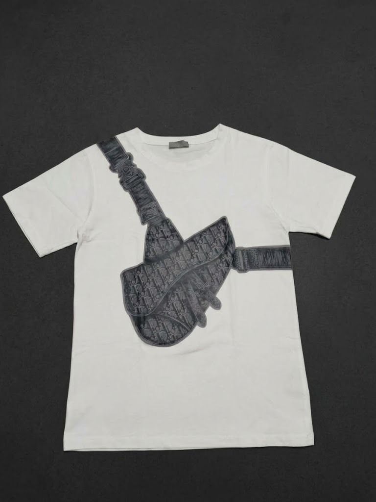 Dior Saddle Bag logo (Category: Shirts) located in Caloocan City. Submitted by silverdragon_aaed38 (Listing ID 1467765898, Image 1). Description: Dior Saddle Bag logo - Complete tags - Size Medium - Dimes W 19 L 27 - Color rate: 10 - No issue ( need wash only ) 2.5k +sf.