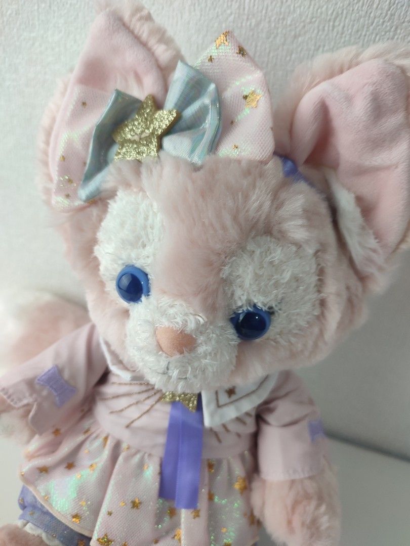 Disney 100 LinaBell Plush Toy Doll (Category: Plushies & Soft Toys) located in Manila. Submitted by epicmountain-f20453 (Listing ID 1467731876, Image 2). Description: - Authentic Disney LinaBell plush toy - Adorable pink and purple star-patterned outfit with a matching ear bow - Features striking blue eyes and a fluffy tail - Special Disney 100 logo embroidered on the left foot paw pad - Original Disney tag attached to the side - Pristine, clean 