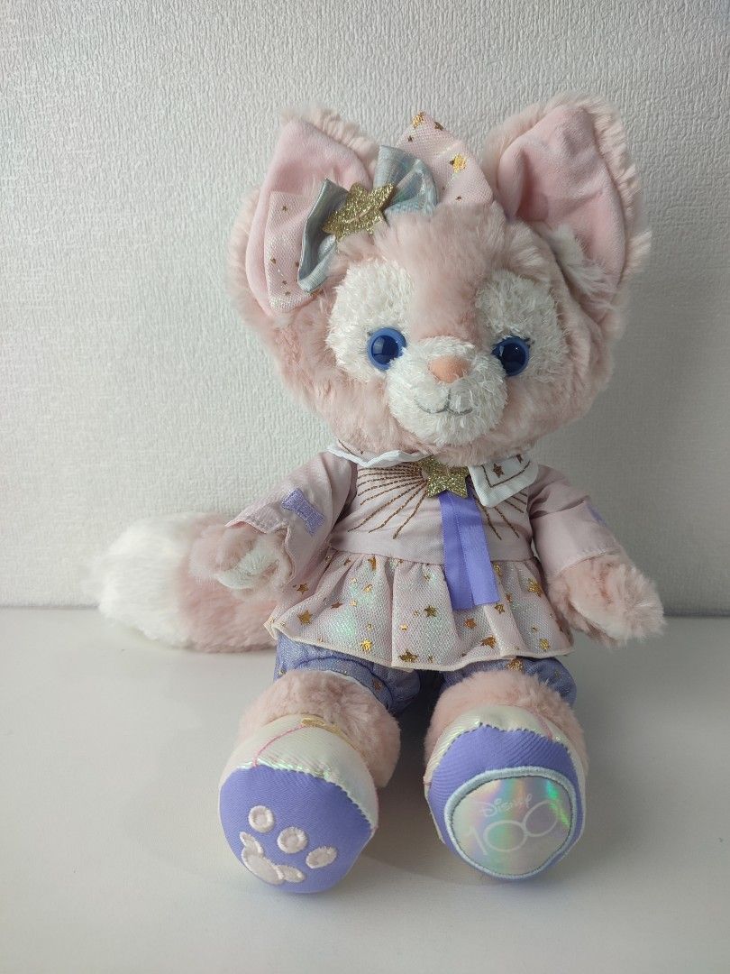 Disney 100 LinaBell Plush Toy Doll (Category: Plushies & Soft Toys) located in Manila. Submitted by epicmountain-f20453 (Listing ID 1467731876, Image 1). Description: - Authentic Disney LinaBell plush toy - Adorable pink and purple star-patterned outfit with a matching ear bow - Features striking blue eyes and a fluffy tail - Special Disney 100 logo embroidered on the left foot paw pad - Original Disney tag attached to the side - Pristine, clean 