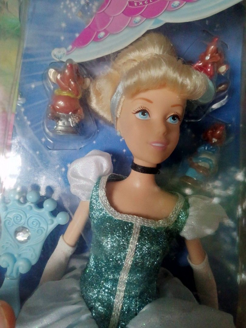 Disney Princess Cinderella Doll Collection (Category: Figurines & Statues) located in Naga. Submitted by cosmicrabbit.09254a (Listing ID 1467708617, Image 3). Description: - Set of 3 Disney Cinderella dolls in unopened, original packaging - Gemini Princess edition: features a sparkly blue gown and tiara - Holiday Princess edition: dressed in a white winter dress - Disney Store exclusive: comes with tiny mouse sidekicks and a mirror accessory - Gr