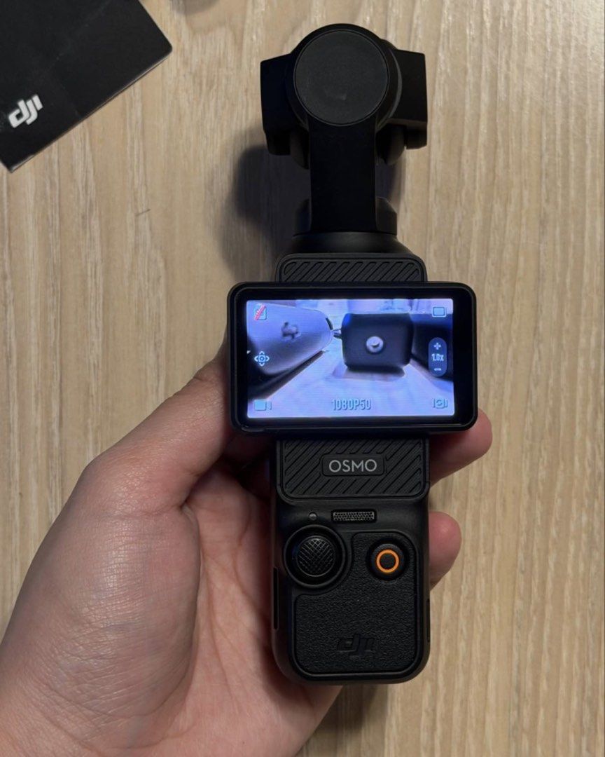 DJI Osmo Pocket 3 Creator Combo (Category: Cameras) located in Pasig City. Submitted by aizabeecaren (Listing ID 1467683698, Image 2). Description: - Item: DJI Osmo Pocket 3 Creator Combo (Fully functional) - Camera Features: Rotating touchscreen, wide-angle lens attachment - Power & Support: Battery handle, mini tripod - Audio: DJI Mic 2 transmitter with fuzzy windscreen - Accessories: USB-C cable, custom carrying bag with internal dividers - In
