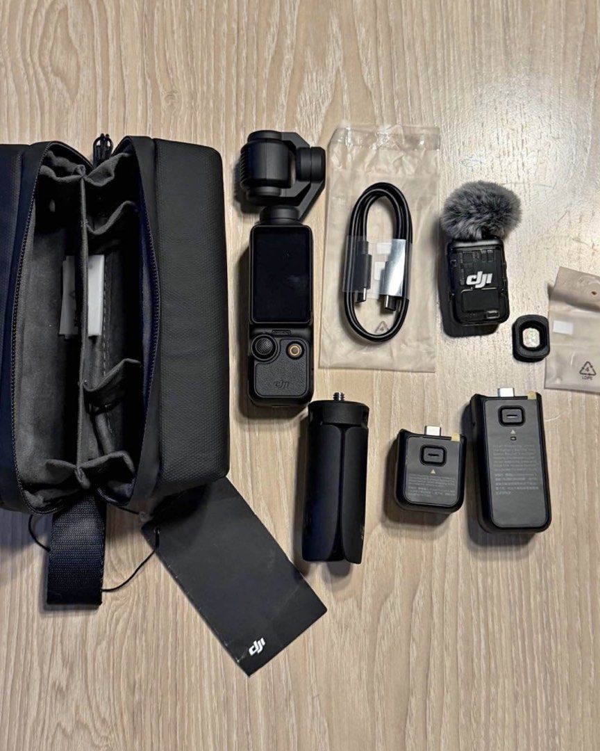 DJI Osmo Pocket 3 Creator Combo (Category: Cameras) located in Pasig City. Submitted by aizabeecaren (Listing ID 1467683698, Image 1). Description: - Item: DJI Osmo Pocket 3 Creator Combo (Fully functional) - Camera Features: Rotating touchscreen, wide-angle lens attachment - Power & Support: Battery handle, mini tripod - Audio: DJI Mic 2 transmitter with fuzzy windscreen - Accessories: USB-C cable, custom carrying bag with internal dividers - In