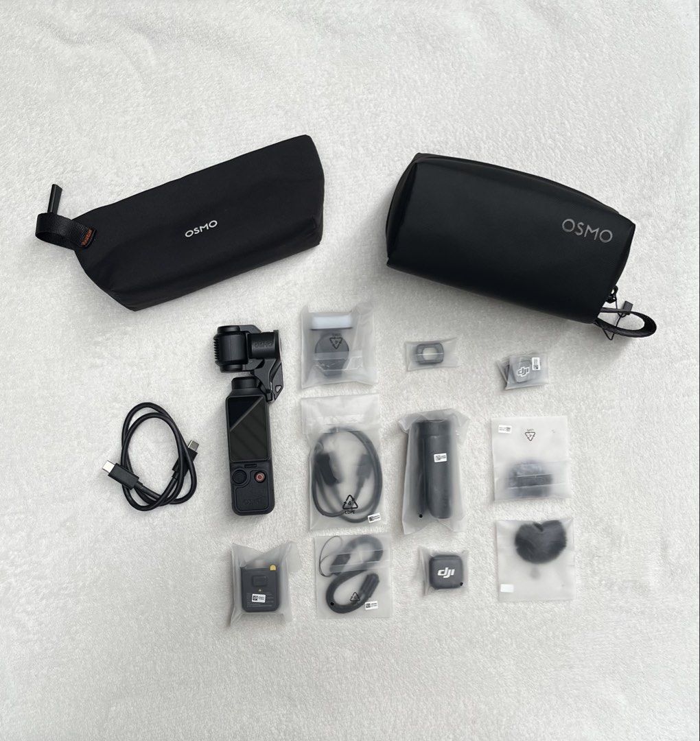 DJI Osmo Pocket 4 Creator Combo (Category: Video Cameras) located in Manila. Submitted by tansells_ (Listing ID 1467651313, Image 1). Description: DJI Osmo Pocket 4 Creator Combo ✨ Details / Inclusions (COMPLETE ✅): - DJI Osmo Pocket 4 - Type C to Type C Charging Cable - Gimbal Clamp - Handle with Thread - Osmo Pocket 4 Fill Light - Wide-Angle Lens - DJI Mic 3 Transmitter - DJI Mic 3 Magnetic Clip - DJI Mic 3 Magnet - DJI Mic 3 Windscreen (Black 