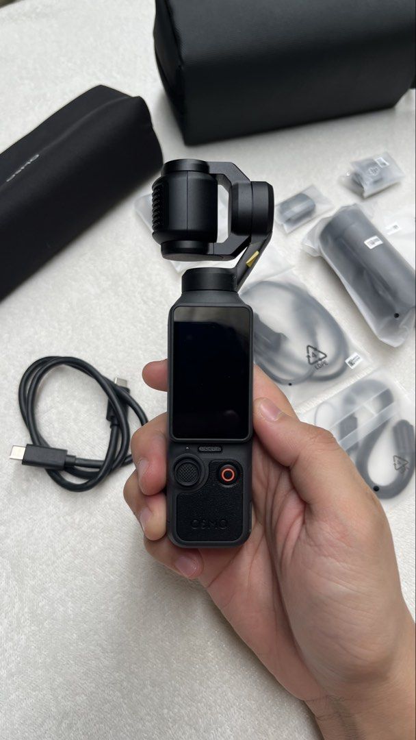 DJI Osmo Pocket 4 Creator Combo (Category: Video Cameras) located in Manila. Submitted by tansells_ (Listing ID 1467651313, Image 3). Description: DJI Osmo Pocket 4 Creator Combo ✨ Details / Inclusions (COMPLETE ✅): - DJI Osmo Pocket 4 - Type C to Type C Charging Cable - Gimbal Clamp - Handle with Thread - Osmo Pocket 4 Fill Light - Wide-Angle Lens - DJI Mic 3 Transmitter - DJI Mic 3 Magnetic Clip - DJI Mic 3 Magnet - DJI Mic 3 Windscreen (Black 