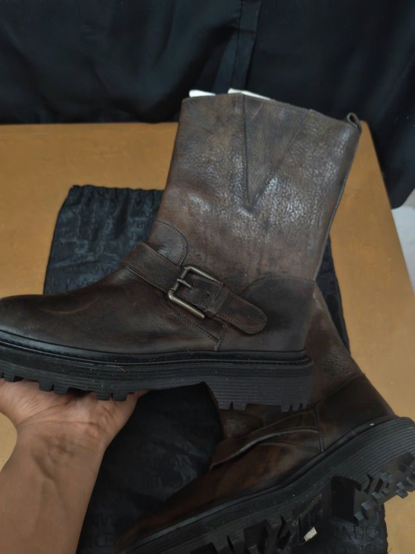 Dolce & Gabbana Brown Leather Boots Size 5.5 (Category: Boots) located in Baguio. Submitted by solo_ukay (Listing ID 1467789070, Image 2). Description: - Brand: Dolce & Gabbana - Style: Chunky lug sole boots with side buckle strap and slip-on design - Color: Brown - Size: 5.5 (marked on inner collar) - Origin: Made in Italy - Inclusion: Original dust bag included - Condition: Excellent pre-loved condition (ready to wear).
