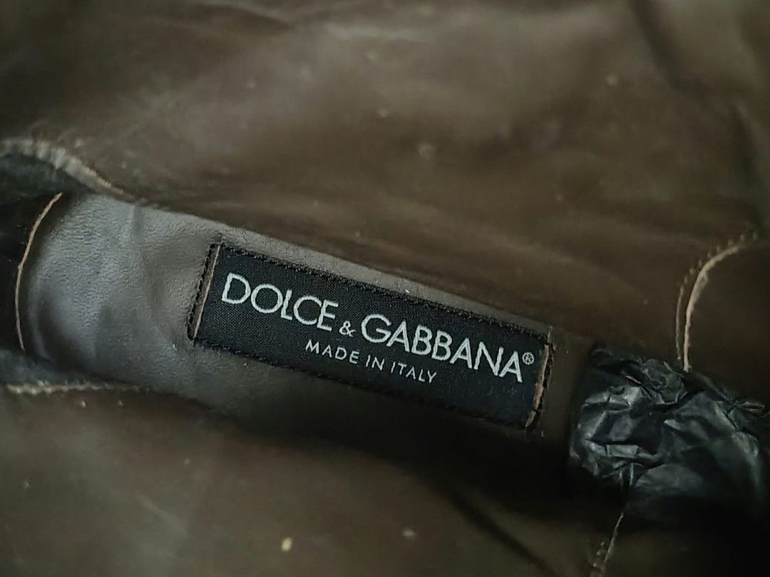 Dolce & Gabbana Brown Leather Boots Size 5.5 (Category: Boots) located in Baguio. Submitted by solo_ukay (Listing ID 1467789070, Image 3). Description: - Brand: Dolce & Gabbana - Style: Chunky lug sole boots with side buckle strap and slip-on design - Color: Brown - Size: 5.5 (marked on inner collar) - Origin: Made in Italy - Inclusion: Original dust bag included - Condition: Excellent pre-loved condition (ready to wear).
