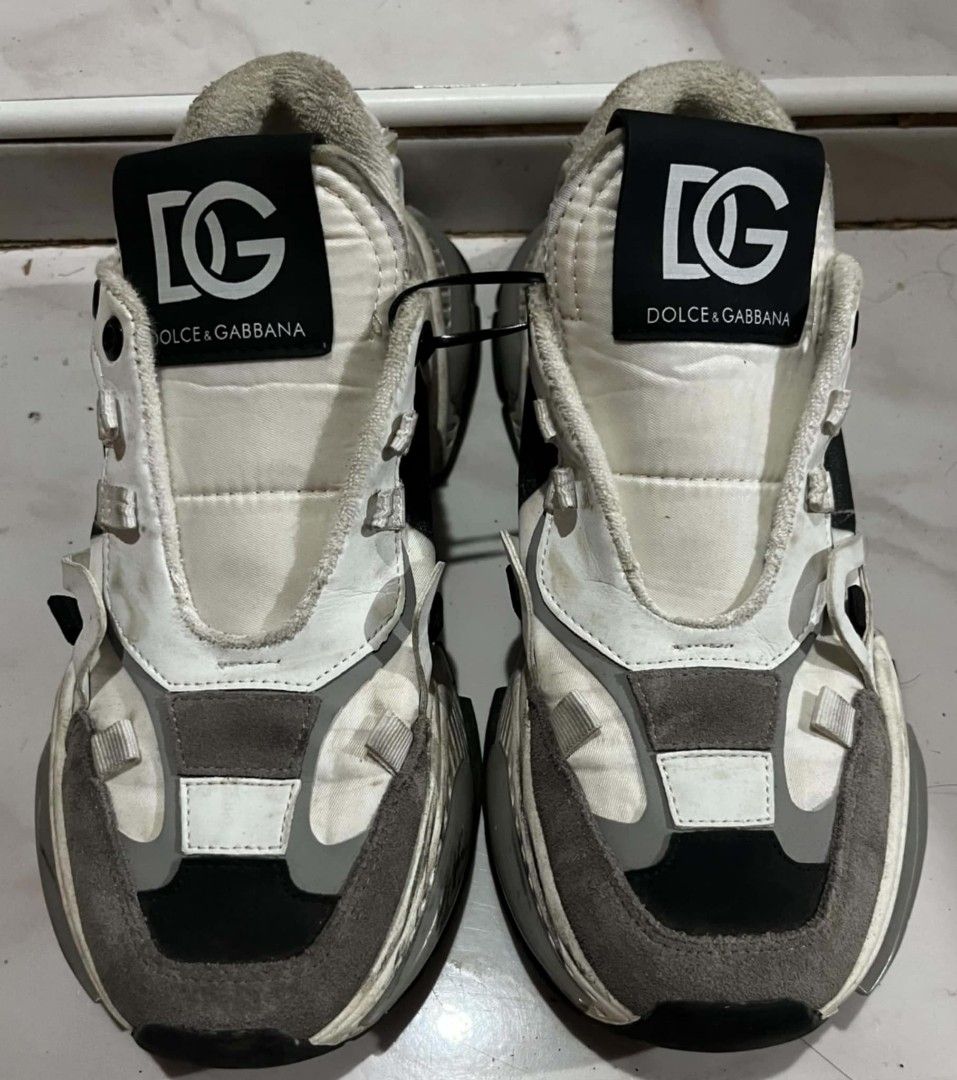 Dolce & Gabbana Sorrento Sneakers (Category: Sneakers) located in Baroy. Submitted by laudecarlfe24 (Listing ID 1467733293, Image 2). Description: - Brand: Dolce & Gabbana - Style: Chunky sneakers with honeycomb sole pattern - Colorway: White, Black, and Grey - Size: 38 (Made in Italy) - Branding: Bold DG logo on tongue and bottom sole - Condition: Noticeable scuffs and dirt marks from previous wear, tons of life left - Perfect for street style e