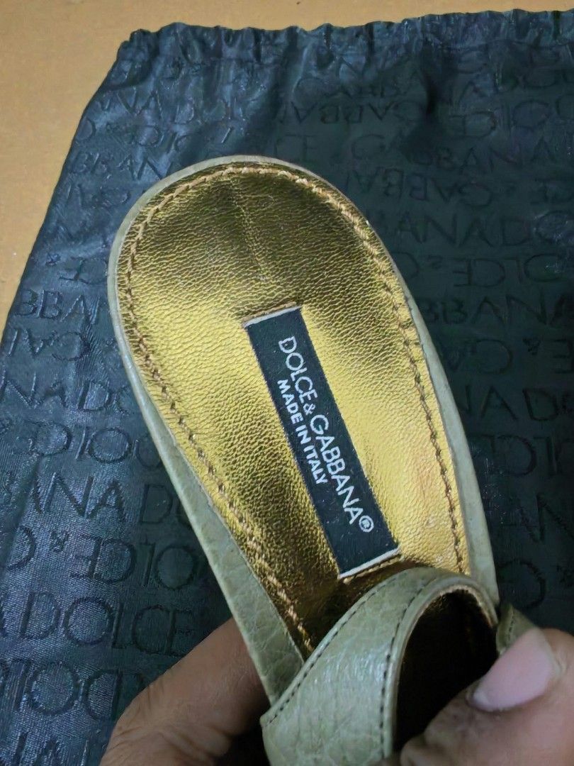 Dolce & Gabbana Textured Slingback Heels (Category: Heels) located in Baguio. Submitted by solo_ukay (Listing ID 1467789159, Image 3). Description: - Brand: Dolce & Gabbana - Style: Slingback heels with pointed toe - Color: Muted green with gold metallic interior - Material: Textured leather - Size: 37 (Made in Italy) - Details: Branded black fabric interior label - Condition: Good pre-loved condition with visible wear on the gold-tone outsole (t