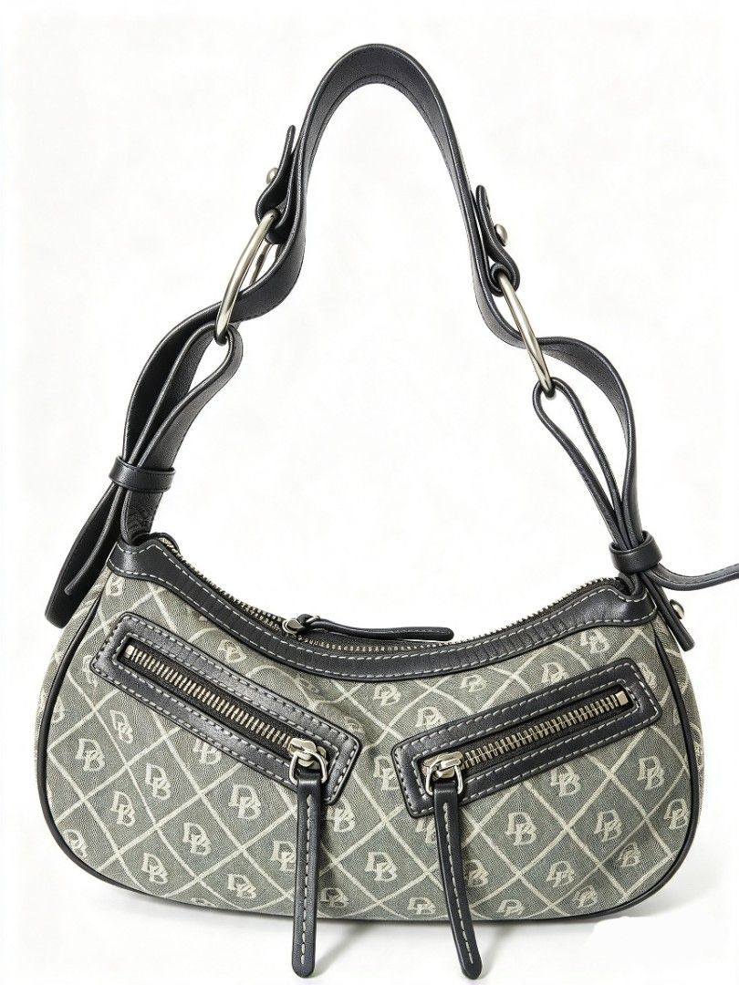 Dooney & Bourke Monogram Shoulder Bag with Front Zippers (Category: Luxury Bags & Wallets) located in Manila. Submitted by jialyn03310_tree (Listing ID 1467832972, Image 1). Description: Grey canvas shoulder bag featuring an all-over monogram pattern, black leather trim, and contrast white stitching. Includes two front zipper pockets, silver-tone hardware, and a secure top zip closure. Clean interior..