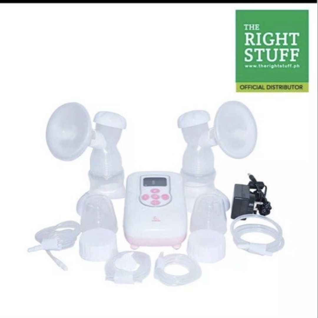 Double electric breast pump set with tubes and bottles (Category: Breastfeeding & Bottle Feeding) located in Muntinlupa City. Submitted by charmycams (Listing ID 1467729621, Image 1). Description: - Complete double electric breast pump setup in clean white and pink - Includes main motor unit, 2 pump collection kits, tubing, bottles, sealing caps, and power adapter - Portable and convenient for working or stay-at-home moms - Easy to assemble, use,