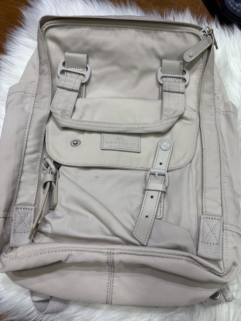 Doughnut Backpack (Category: Backpacks) located in Singapore. Submitted by allfromsg (Listing ID 1467775952, Image 4). Description: Authentic Doughnut backpack Free tracked delivery Slight stain 27cm W x 13cm D x 38cm H 420D Crinkle Nylon Twill Water Repellent Water Bottle Compartment Up To 14-Inch Laptop Compartment Padded Adjustable Shoulder Straps Real Leather Trimming .