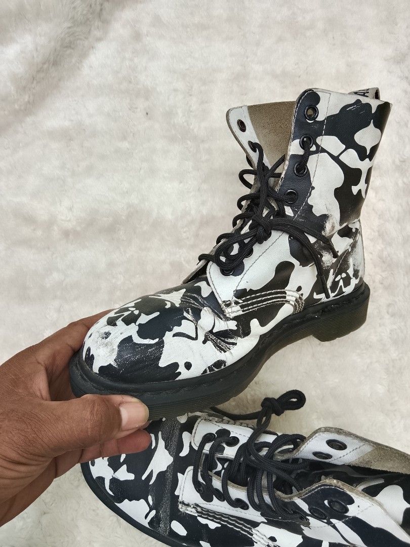 Dr. Martens Black and White Patterned Boots (Category: Boots) located in Bantayan. Submitted by markjimenez1975557 (Listing ID 1467740029, Image 3). Description: good condition issue heel drag sign of use but still wearable and presentable - Authentic Dr. Martens 1460 lace-up boots - Eye-catching black and white abstract pattern - Classic AirWair heel loops and black laces included - Condition note: Visible scuffing and wear on the white leather 