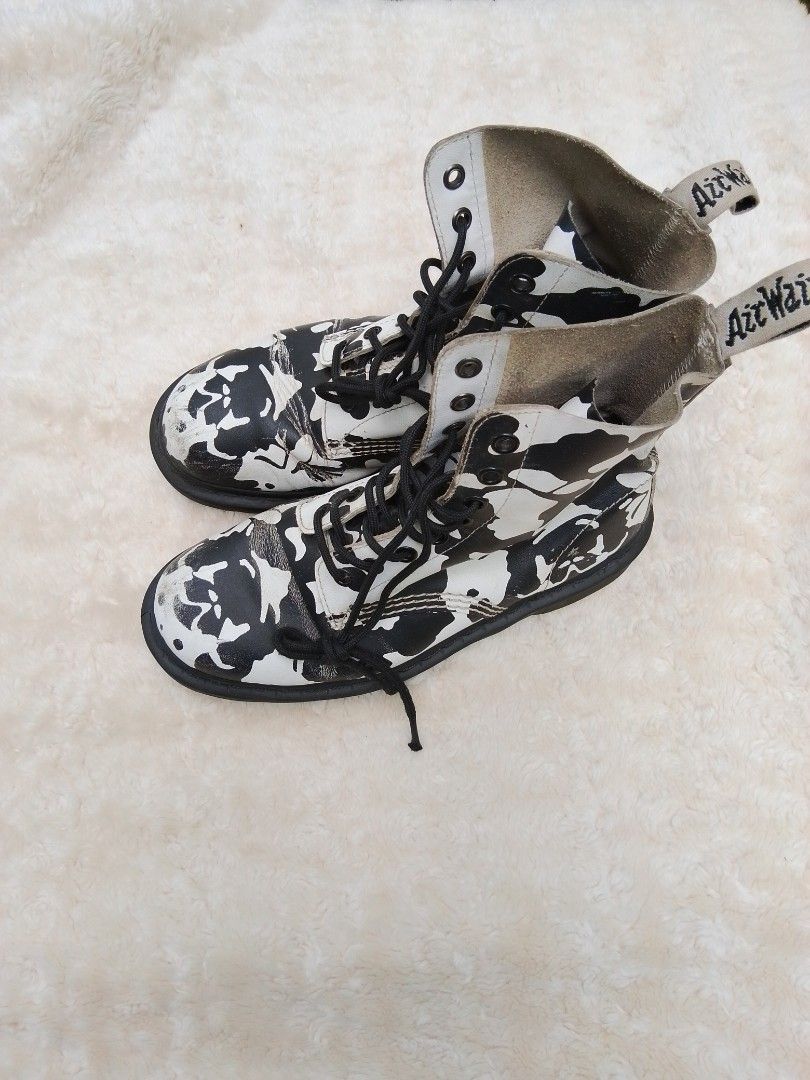 Dr. Martens Black and White Patterned Boots (Category: Boots) located in Bantayan. Submitted by markjimenez1975557 (Listing ID 1467740029, Image 1). Description: good condition issue heel drag sign of use but still wearable and presentable - Authentic Dr. Martens 1460 lace-up boots - Eye-catching black and white abstract pattern - Classic AirWair heel loops and black laces included - Condition note: Visible scuffing and wear on the white leather 