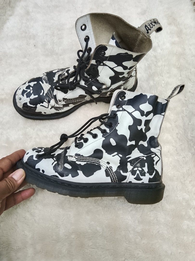 Dr. Martens Black and White Patterned Boots (Category: Boots) located in Bantayan. Submitted by markjimenez1975557 (Listing ID 1467740029, Image 2). Description: good condition issue heel drag sign of use but still wearable and presentable - Authentic Dr. Martens 1460 lace-up boots - Eye-catching black and white abstract pattern - Classic AirWair heel loops and black laces included - Condition note: Visible scuffing and wear on the white leather 