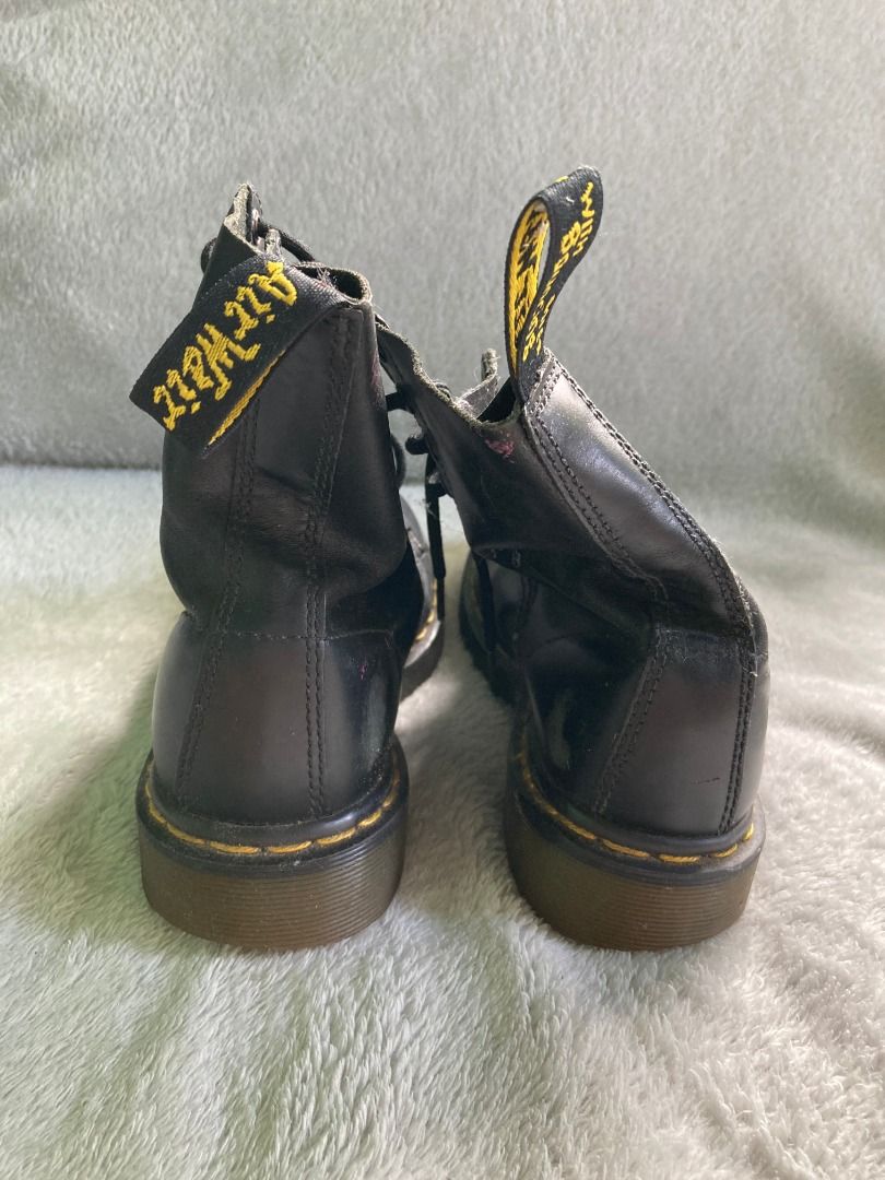 Dr. Martens Pascal Black Leather Boots (Category: Boots) located in Rizal. Submitted by sheeraay (Listing ID 1467708925, Image 3). Description: - Brand: Dr. Martens - Style: Classic 8-eyelet lace-up boots - Color: Black leather with iconic yellow welt stitching and heel loops - Condition: Pre-loved with visible scuffs on the toe area and moderate wear on soles - Longevity: Well-maintained and still has plenty of life left for daily wear.