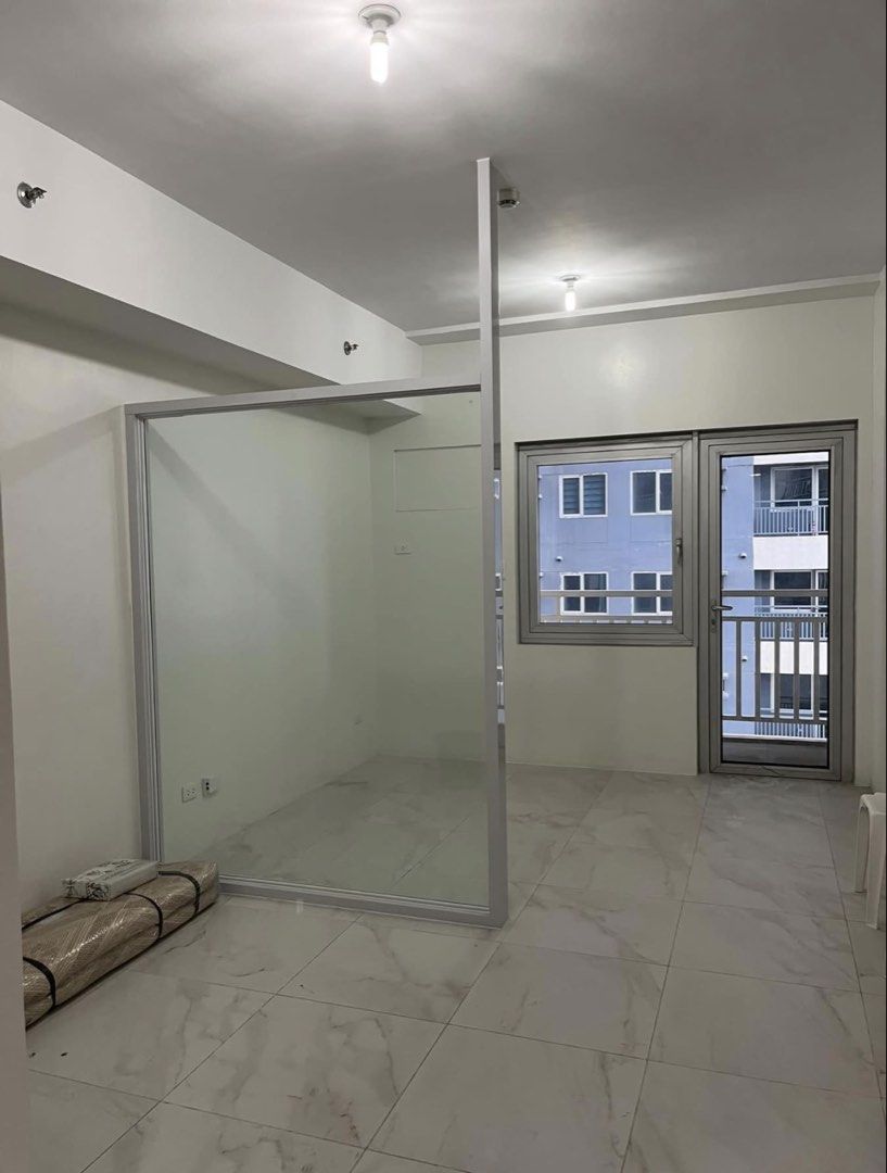Dream Tower Studio Unit (Category: Apartments & Condos) located in Manila. Submitted by banidosa (Listing ID 1467615356, Image 3). Description: Executive Studio with Balcony (+parking unit) @ Nuvo District (Dream Tower) - converted to Junior 1 Bedroom (via installed glass partition) - Asking Price: Php 5,489,000 (negotiable) DESCRIPTION - Unit at 7th floor - Parking unit at Level 2 - Total lot area: 34 square meters - Floor area: 28 square meters