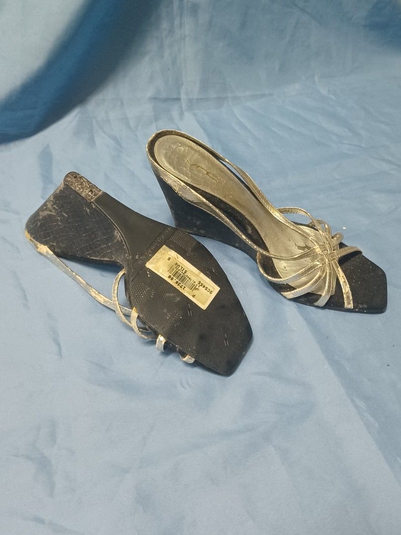 DUA strappy silver wedge block heels 2000s (Category: Heels) located in Pasig City. Submitted by croisshark (Listing ID 1467727008, Image 3). Description: - quality heel if you can salvage the straps! vintage style early 2000s party heels with a slender silhouette - leather straps are cracking/flaking off but do not affect the comfort - heel tip has cracked off but you can see from the sole it was barely used.