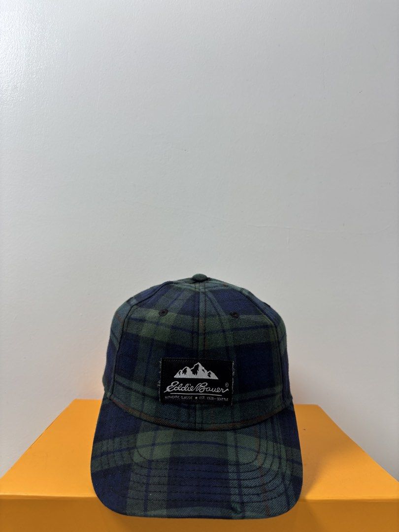 Eddie Bauer Green Tartan Plaid Baseball Cap (Category: Caps & Hats) located in Marikina City. Submitted by zaxcheus_castillo1708 (Listing ID 1467654062, Image 1). Description: - Brand: Eddie Bauer - Design: Green and blue tartan plaid, classic six-panel - Details: Front woven logo patch, brown adjustable strap with metal hardware - Material: 100% cotton for a comfortable fit - Size: One size fits most - Condition: Clean inside and out, ready to w