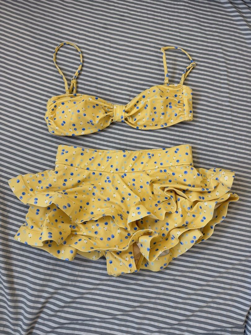 Eighth Mermaid Sasha Set (Category: Bikinis & Swimsuits) located in Manila. Submitted by qfayeeeee (Listing ID 1467627132, Image 2). Description: - Brand: Eighth Mermaid - Size: Medium (M) - Design: Yellow with blue berries and white flowers - Top: Adjustable straps with front tie detail - Bottoms: High-waisted with layered ruffles - Care: Hand wash only - Freebie: Includes a clear waterproof zip pouch ✅Note: I just bought this here in Carousell 