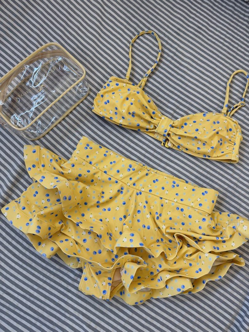 Eighth Mermaid Sasha Set (Category: Bikinis & Swimsuits) located in Manila. Submitted by qfayeeeee (Listing ID 1467627132, Image 1). Description: - Brand: Eighth Mermaid - Size: Medium (M) - Design: Yellow with blue berries and white flowers - Top: Adjustable straps with front tie detail - Bottoms: High-waisted with layered ruffles - Care: Hand wash only - Freebie: Includes a clear waterproof zip pouch ✅Note: I just bought this here in Carousell 