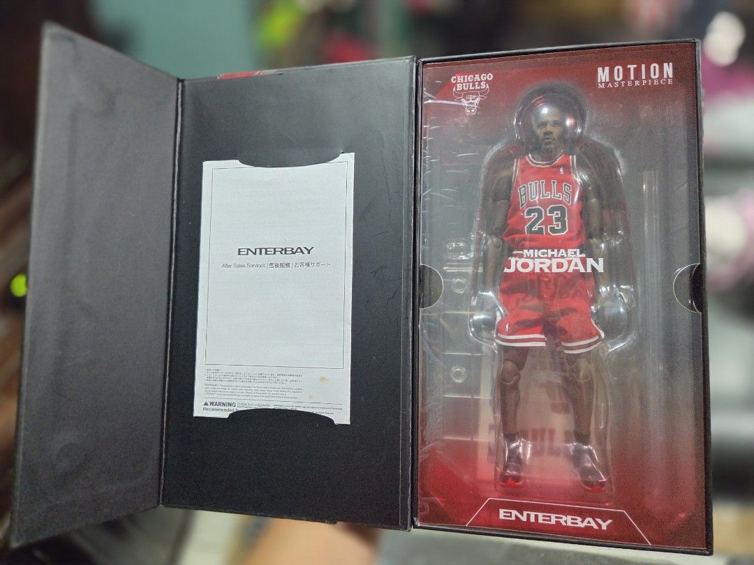 Enterbay Masterpiece Michael Jordan 1/9 scale (Category: Figurines & Statues) located in Manila. Submitted by artbag2606 (Listing ID 1467837842, Image 3). Description: MJ 1/9 scale Enterbay - Brand/Model: Enterbay Motion Masterpiece Michael Jordan Action Figure - Team/Jersey: Chicago Bulls Red Jersey, #23 - Authenticity: Upper Deck Authenticated memorabilia box included - Inclusions: Original packaging and manual - Condition: Highly detailed coll