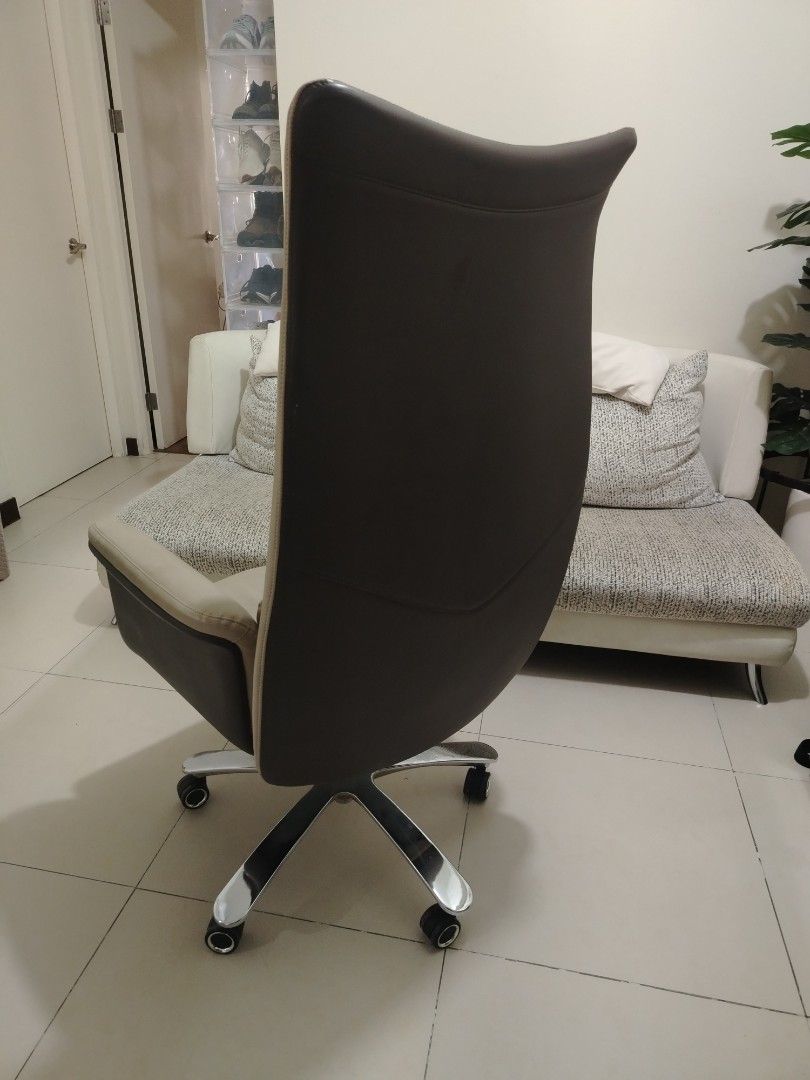 Ergonomic High Back Executive Office Chair Beige Brown (Category: Office Furniture & Fixtures) located in Pasig City. Submitted by juniort2001 (Listing ID 1467668908, Image 3). Description: - Elegant executive high-back office chair in beige and dark brown leatherette - Thick padded cushioning on the seat, backrest, and headrest for maximum all-day support - Sturdy chrome star base equipped with smooth-rolling caster wheels - Fully functional hei