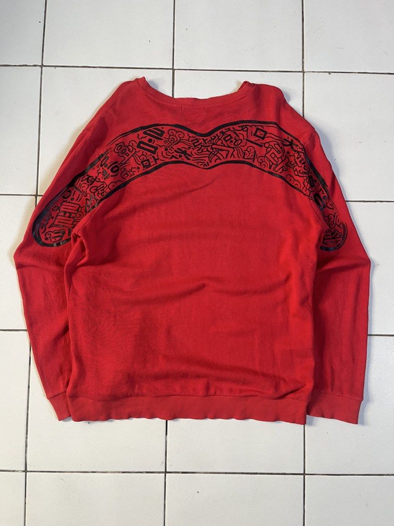 Evisu Red Sweatshirt with Graphic Print Size 110 (Category: Coats, Jackets and Outerwear) located in Candaba. Submitted by tristanpelayoo (Listing ID 1467734670, Image 1). Description: - Brand: Evisu - Color: Red - Style: Classic crewneck sweatshirt - Size: 110 - Design: Cool black graphic print across the back and shoulders, with small embroidered Korean characters on the front chest - Details: Ribbed cuffs and collar hold their shape very well 