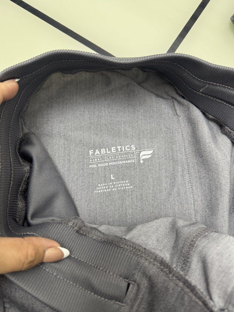 Fabletics Grey Scrubs Jogger Pants Size L (Category: Joggers) located in Arayat. Submitted by janeng_ba10fd (Listing ID 1467620474, Image 3). Description: - Brand: Fabletics - Size: Large - Color: Heather Grey - Waistband: Ribbed elastic with adjustable drawstring - Pockets: Multiple utility pockets including a back pocket and cargo side pocket - Origin: Made in Vietnam - Condition: Clean, excellent, ready to wear - Ideal for: Healthcare work shi