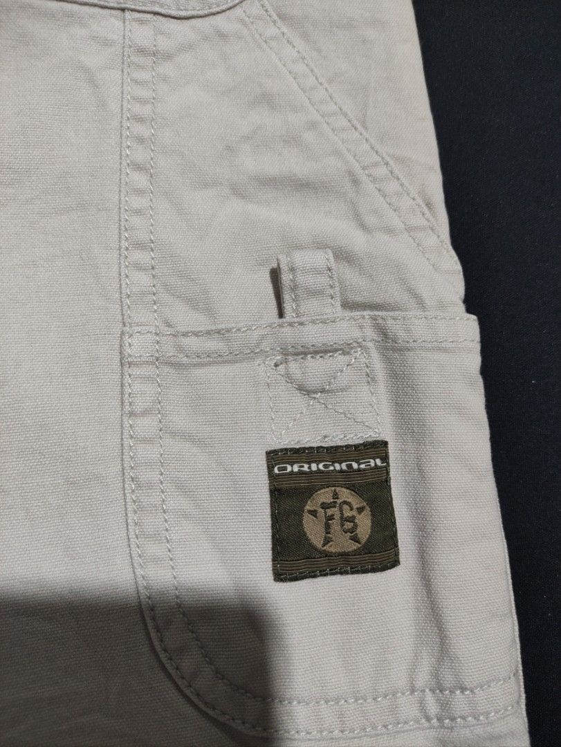 Faded Glory Stone Cargo Shorts Size 34 (Category: Shorts) located in Binan City. Submitted by mmrl_rmwl00 (Listing ID 1467794918, Image 3). Description: Faded Glory cargo shorts in stone colour. Made from 100% cotton canvas material. Men's size 34 waist. Button closure and zippered fly. Multiple pockets including utility and back flap pockets with branded logo patches. Casual style for everyday wear..