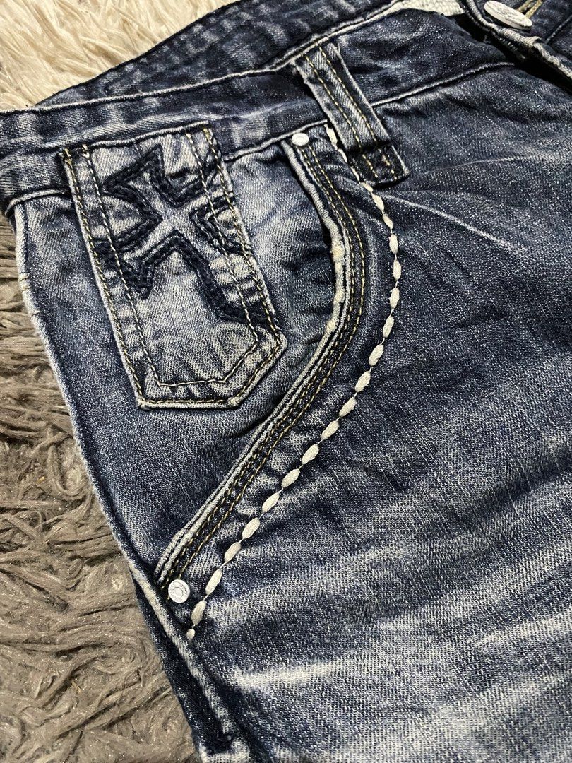 Fairwhale Jeans Blue Denim Size 30 Y2K Flared (Category: Jeans) located in Manila. Submitted by coollion.19b40f (Listing ID 1467775107, Image 2). Description: - Brand: Fairwhale - Size: 30 (170/75A) - Material: 100% cotton - Waist: Mid-rise with heavy contrast stitching - Details: Washed finish with whiskering - Pockets: Button flap back pockets and embroidered cross coin pocket - Style: Decorative vertical striping patterns down the lower legs.