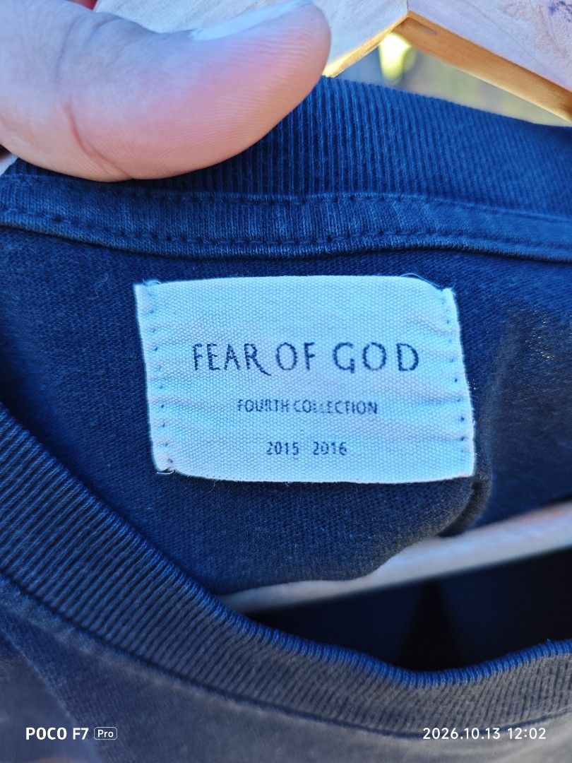Fear of God (Category: Activewear) located in Mexico. Submitted by josephnuqui1980 (Listing ID 1467641324, Image 3). Description: This is a vintage-style Fear of God short-sleeve graphic t-shirt featuring a dark landscape/cross art print with a flying bird/dragon silhouette and gothic "FEAR OF GOD" lettering..