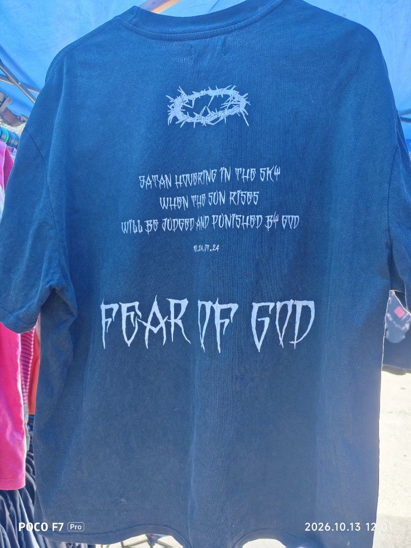 Fear of God (Category: Activewear) located in Mexico. Submitted by josephnuqui1980 (Listing ID 1467641324, Image 2). Description: This is a vintage-style Fear of God short-sleeve graphic t-shirt featuring a dark landscape/cross art print with a flying bird/dragon silhouette and gothic "FEAR OF GOD" lettering..