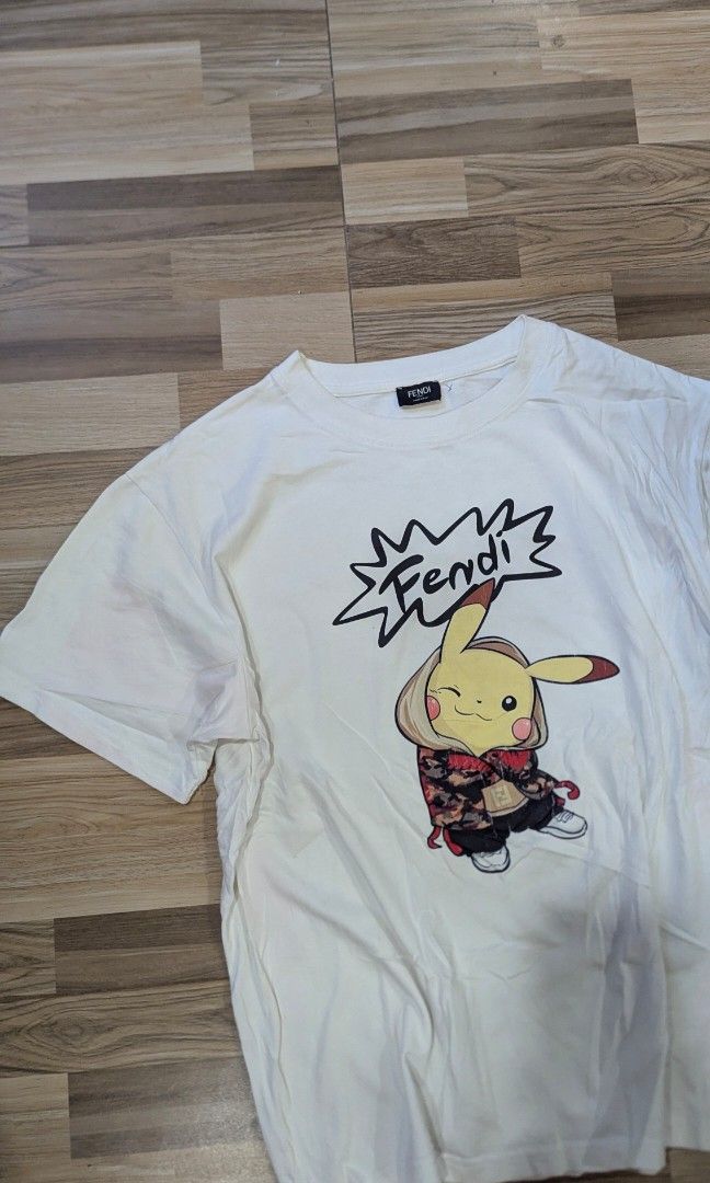 Fendi Pikachu T-shirt (Category: Luxury Apparel) located in Pasay City. Submitted by aatapparelshop (Listing ID 1467701057, Image 2). Description: Fendi Pikachu T-shirt size large dimes L25 W22 GOOD CONDTION 1600 SHIPED.