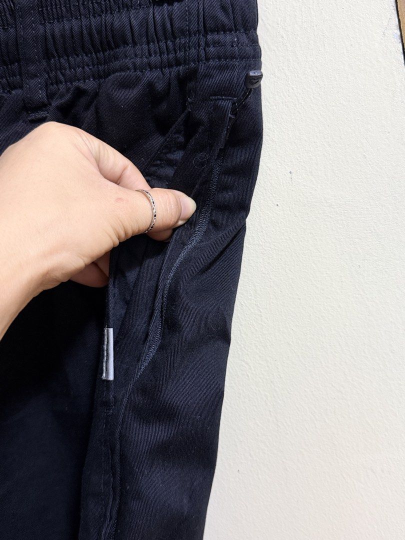 FieldCore Black Outdoor Utility Pants (Category: Trousers) located in Paete. Submitted by skydruemadison (Listing ID 1467763325, Image 2). Description: - Brand/Model: FieldCore Utility Pants - Color: Versatile Black - Fit: Relaxed fit for all-day comfort - Waistband: Elastic with adjustable drawstring - Pockets: Secure zipped side pockets + back patch pockets - Material: Durable cotton blend - Best For: Casual wear and outdoor activities.