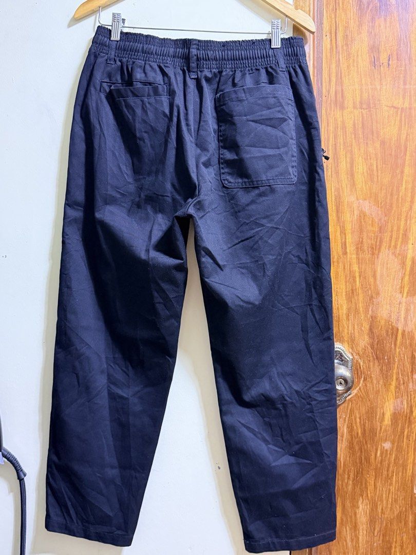 FieldCore Black Outdoor Utility Pants (Category: Trousers) located in Paete. Submitted by skydruemadison (Listing ID 1467763325, Image 3). Description: - Brand/Model: FieldCore Utility Pants - Color: Versatile Black - Fit: Relaxed fit for all-day comfort - Waistband: Elastic with adjustable drawstring - Pockets: Secure zipped side pockets + back patch pockets - Material: Durable cotton blend - Best For: Casual wear and outdoor activities.