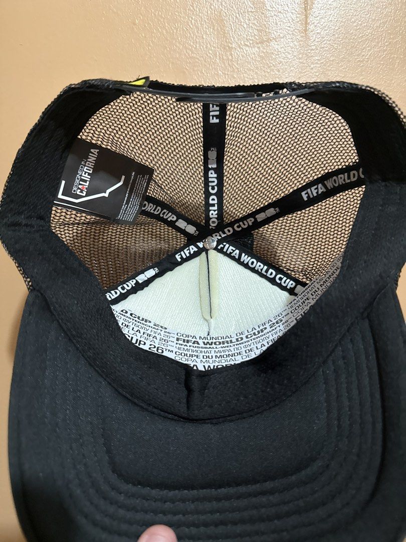 FIFA World Cup 26 T2 Poly Mesh Foam Trucker Hat (Category: Caps & Hats) located in Dasmarinas. Submitted by great______finds (Listing ID 1467709141, Image 2). Description: - Official licensed FIFA World Cup 2026 merchandise - Brand new with original tags attached - Color: Black with multi-colored trophy graphic on front foam panel - Breathable mesh back panels with adjustable snap closure - Great collectible item for the upcoming tournament.