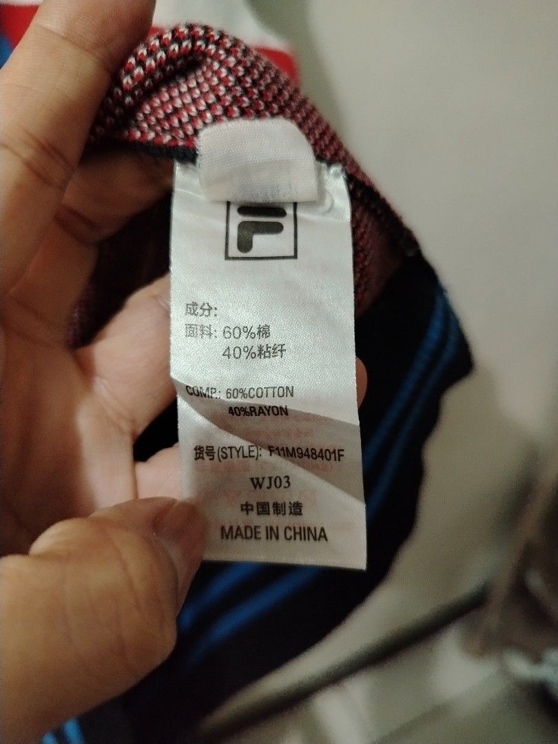 FILA White Line Checkered Knitted Sweater XL (Category: Coats, Jackets and Outerwear) located in Manila. Submitted by zyclothing03 (Listing ID 1467743112, Image 3). Description: - Brand: FILA White Line - Size: XL - Material: 60% cotton, 40% rayon (thick knit) - Design: Checkered pattern, bold chest logo, and lower typography details - Features: Ribbed collar, cuffs, and hem - Condition: Great for cooler weather.